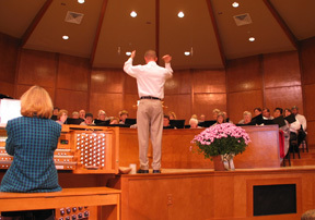seated choir with director