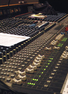 Large audio console in a recording studio